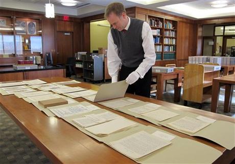 Marquette University Archivist Bill Fliss arranges some of the 11,000 J.R.R. Tolkien papers the university owns in the library of the Milwaukee school; home to the largest Tolkien collection in the world. Photo courtesy Carrie Antlfinger, Associated Press.