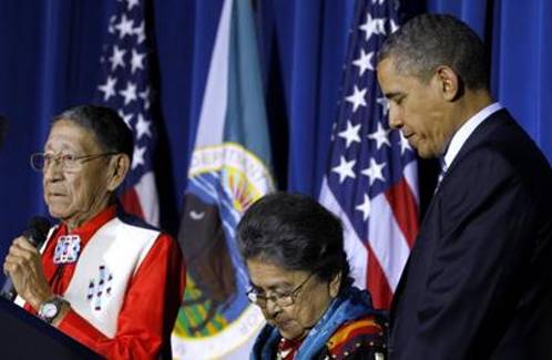 Hartford and Mary Black Eagle and President Barack Obama bow their heads in prayer during the White House Tribal Nations Conference at the Interior Department in Washington on December 2, 2011.