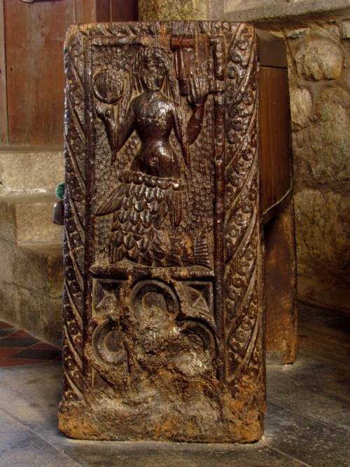 Wood carving of a mermaid on a bench in the Church of St. Senara, in the village of Zennor, West Cornwall, England.